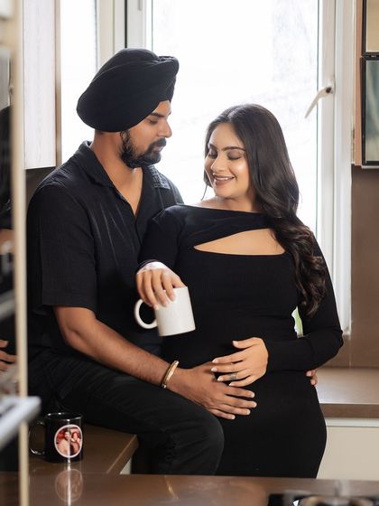 Another angle of the couple's coffee moment, this shot focuses on their loving gaze and the gentle way they hold each other, telling a story of partnership and shared dreams.