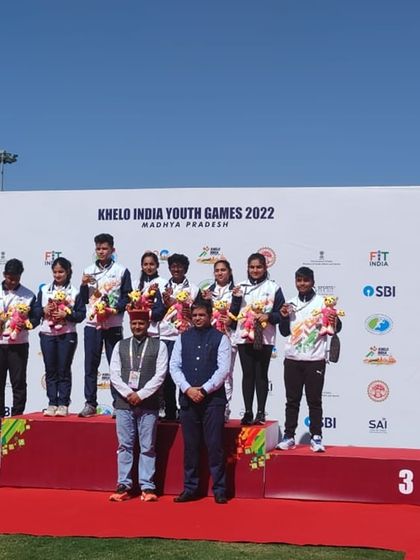 Our shooter Yukthi with her team on the podium after winning a bronze medal in the 10m Air Rifle Mixed Team event at the Khelo India Youth Games 2022.