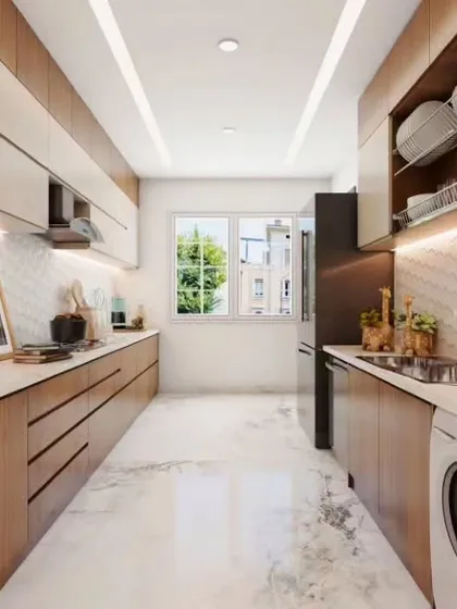 Perfect for long, narrow spaces, this parallel kitchen layout maximizes efficiency. We used light wood tones and white marble-effect flooring to create a bright, airy feel, while integrating a washing machine and providing ample overhead dish storage.