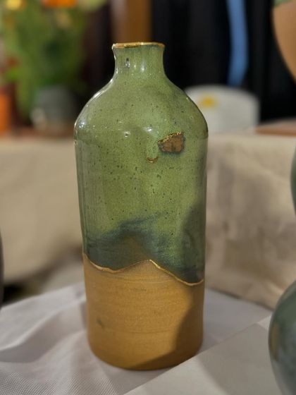 A few of my favorite finished vases from a recent collection, featuring a variety of glazes, painted details, and forms. Each one has its own personality.