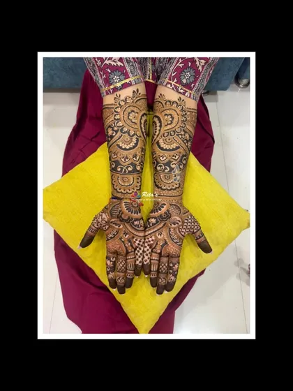 The full view of both arms, showcasing the symmetry and complexity of the Dubai-style mehendi.