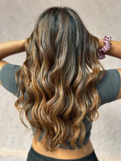 The back view of this fresh New Year's hair. The balayage is perfectly blended for a natural, sun-kissed look.