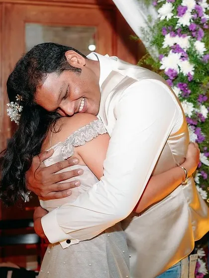 A moment of pure happiness and relief during an engagement party. This candid hug captures the overwhelming joy and love that surrounds you on your special day.