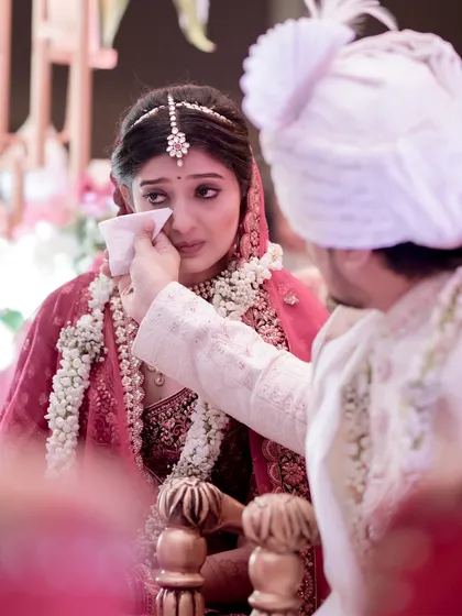 These are the moments that truly define a wedding. As the bride was overcome with emotion during the ceremony, the groom’s simple, tender gesture of wiping away her tear said everything. My focus is always on these quiet, powerful interactions that reveal the deep connection between two people.