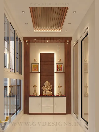 A balcony can be more than just a balcony; it can be a sanctuary. For this home, we designed a serene puja space in the balcony, creating a peaceful corner for reflection that benefits from natural light and air. The design incorporates custom cabinetry, elegant backlighting, and a wooden rafter ceiling detail.