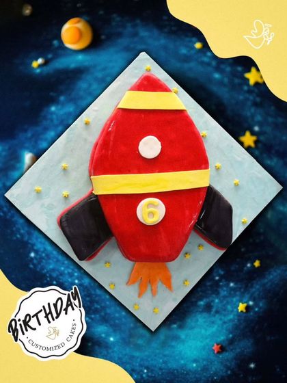 A rocket-shaped cake ready for blast-off. This fun design is perfect for a space-themed party, launching the birthday celebration into another galaxy.