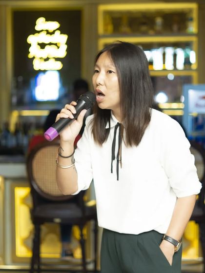 A guest confidently takes the stage. It doesn't matter if you're a beginner or a pro, my events are a judgment-free zone for everyone to enjoy.