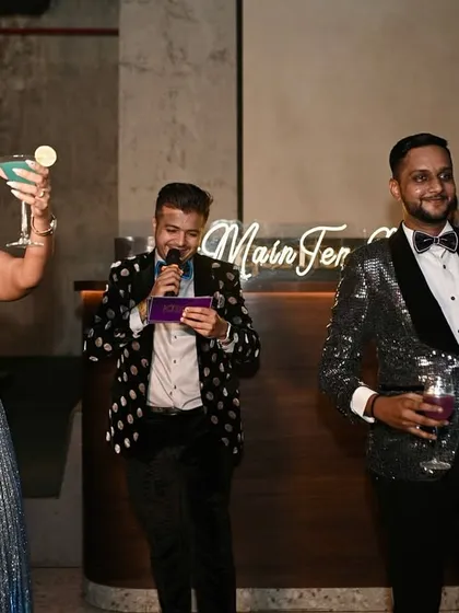 In the middle of a fun drinking game at a cocktail party. My job is to make sure the couple and their guests are having the time of their lives.