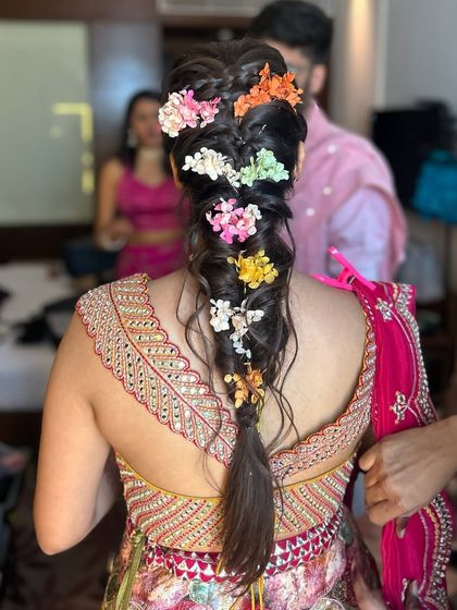 A close-up of the vibrant, multi-colored floral braid. Using a variety of small flowers creates a beautiful, textured look that’s full of personality.