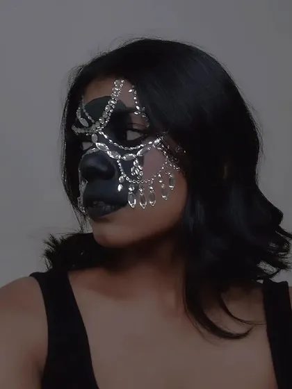 Another angle of the rhinestone mask, showing the intricate placement of the different shapes and sizes of gems.