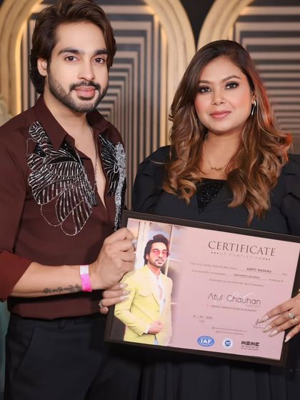 A confident graduate, certificate in hand. I'm excited to see her future work.