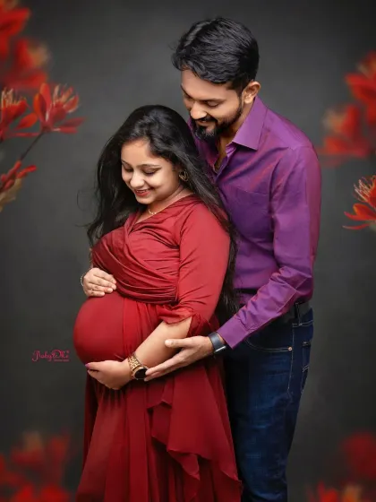 A sweet moment of the dad to be looking down at the baby bump. These are the simple, loving gestures that make for unforgettable maternity photos.