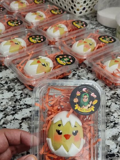 A look at how I package my marzipan Easter eggs. Each little chick is nestled in a clear box with colourful shredded paper, making it a perfect, ready-to-give Easter treat.