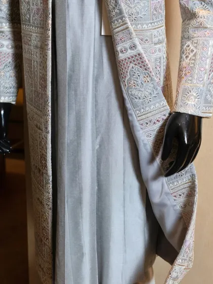 Revealing the smooth, breathable inner lining of the heavily embroidered sherwani. This ensures that even our most ornate pieces are comfortable to wear for long hours of celebration.
