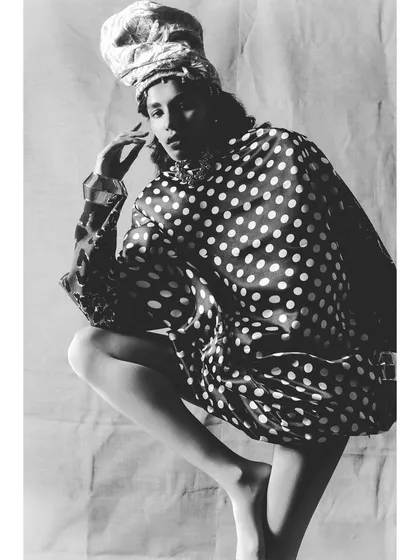 A striking black and white image from 'Neo-Boheme'. The high-contrast lighting and bold polka-dot pattern create a graphic, high-fashion look.