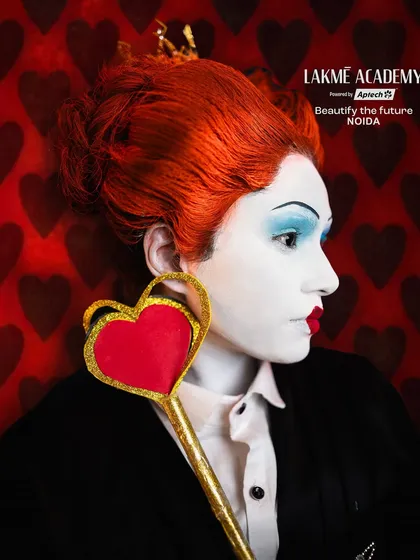 A creative portrait with a heart-themed background. This shot demonstrates how to use props and backdrops to enhance the story of a character makeup.