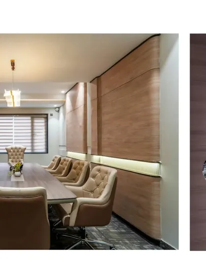 The conference room in the Shri Ram office features curved wood-paneled walls and elegant, comfortable seating. The design aims to create a space that is both professional and inspiring.