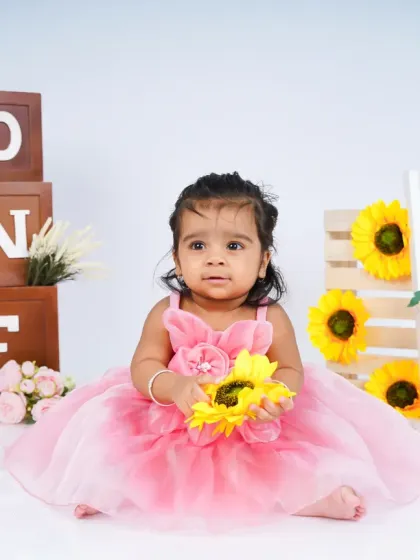 A sweet, thoughtful expression from the birthday girl. Not every shot has to be a wide smile; sometimes the quiet moments are just as precious.