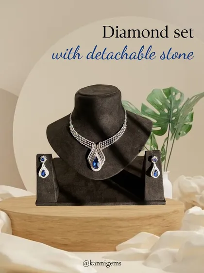 The same diamond set, now featuring a deep blue sapphire. This demonstrates the versatility of the piece, allowing you to match your jewellery to your outfit and occasion.