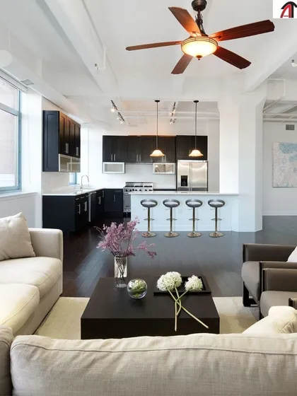 Your home, intelligently upgraded. This open-concept living space features integrated lighting and climate control that enhances the flow and functionality of the area, making it more comfortable and efficient.