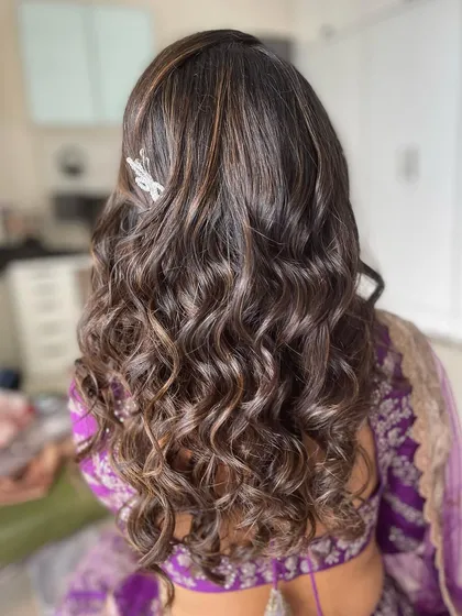 The back view of the voluminous curls, showing the texture and highlights.