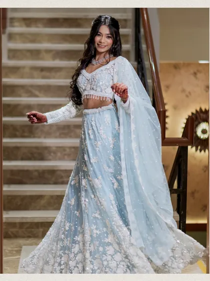 A joyful and candid shot of the bride. Her natural smile and movement bring a sense of life and happiness to this beautiful portrait on the stairs.
