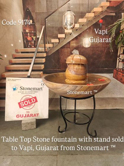 A full shot of the tabletop stone fountain with its stand, sold to Vapi, Gujarat.