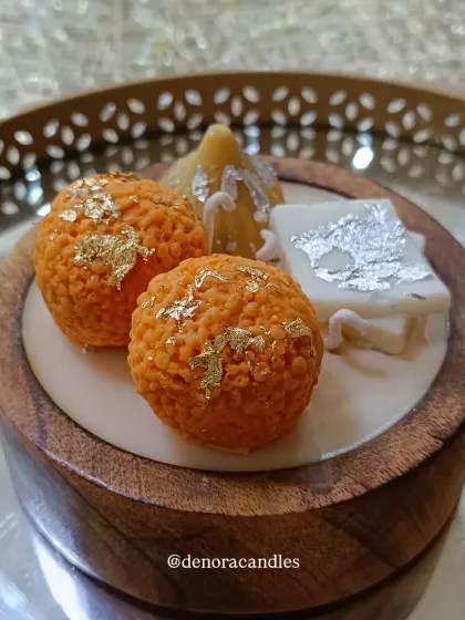 Another close-up of the dessert platter, showing the realistic textures of the wax sweets.