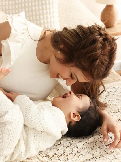 Just the two of us. A quiet, tender moment between mother and child. The soft lighting and cozy setting make this an incredibly warm and emotional portrait.