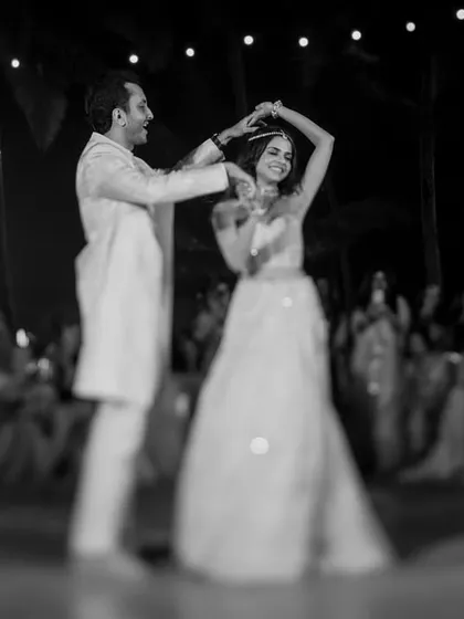 Sid and Sarah, the personification of elegance. A first dance is more than just steps; it's a conversation without words. We use light and shadow in our black and white photography to focus on the connection and the graceful flow of the moment.