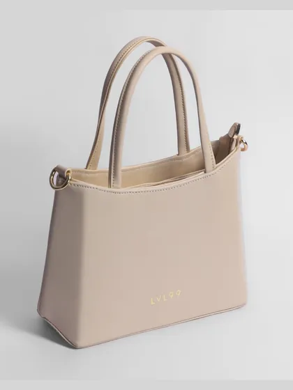 This stylish women's handbag is photographed with perfect lighting to showcase its shape, texture, and color. Clean, high quality images like this are essential for selling fashion accessories online and building customer trust.