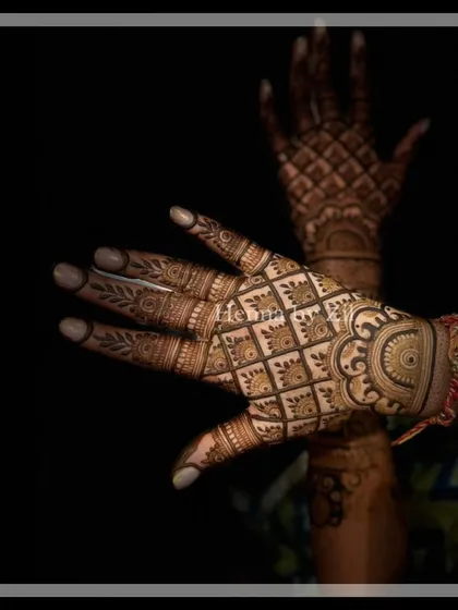 A professionally shot photo that captures the beautiful depth of the henna stain against a dark background.