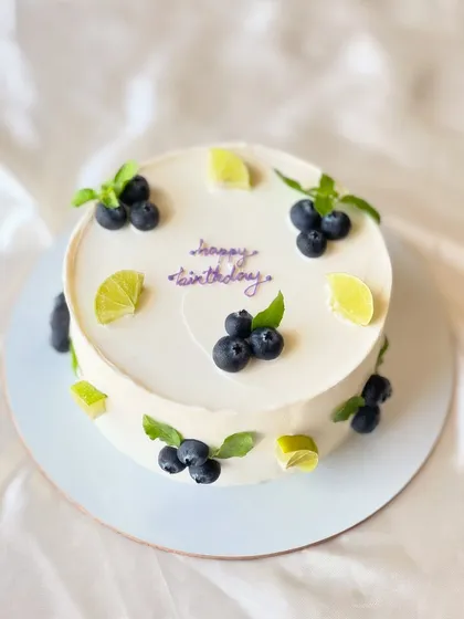 My most popular creation, the signature Italian Lemon & Blueberry cake. I offer many design variations, all featuring fresh blueberries, zesty lime, and smooth buttercream.