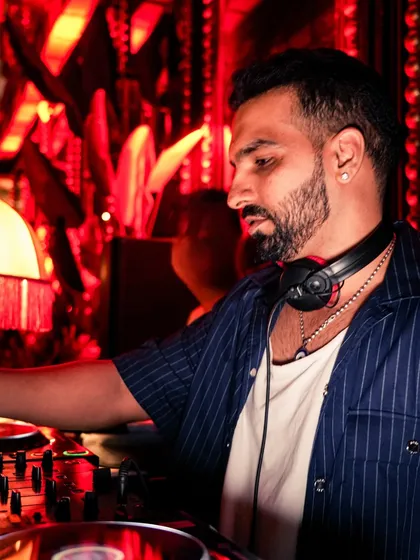 A profile shot of me in deep concentration at the decks. Reading the crowd and selecting the next song is a crucial part of the craft.