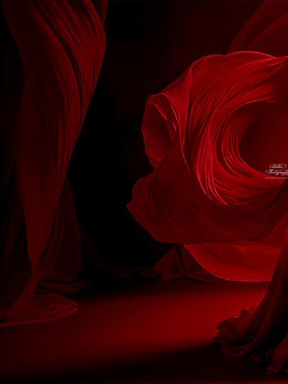 The power and beauty of motherhood captured in a single frame. We use dramatic lighting and flowing red fabric to create this breathtaking, high-fashion look in the studio.