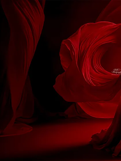 The power and beauty of motherhood captured in a single frame. We use dramatic lighting and flowing red fabric to create this breathtaking, high-fashion look in the studio.