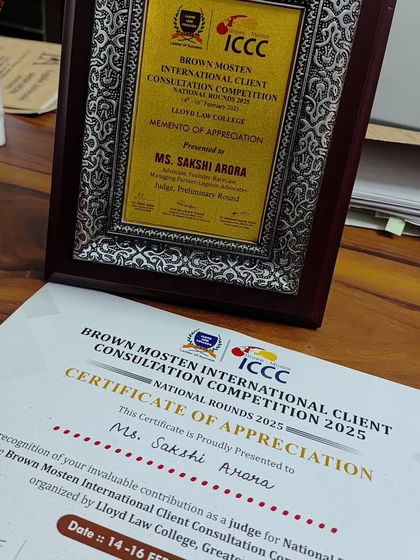 The certificate and memento of appreciation from the competition. These acknowledgements motivate me to continue contributing to legal education and mentorship.