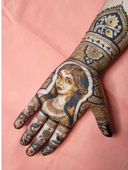 This is a perfect example of my portrait work, where I blend artistic shading with traditional henna elements. I love creating these expressive, one-of-a-kind pieces that truly stand out.
