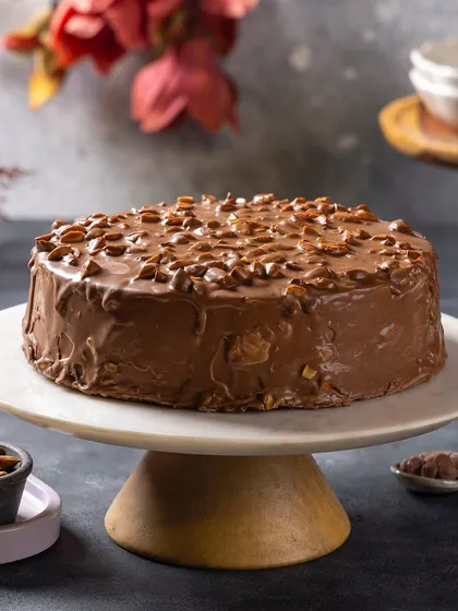 An almond-crusted chocolate cake for Ferns N Petals Luxe. The composition is simple and lets the cake's texture be the hero.