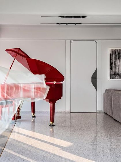 The kitchen in The Sanctuary project is designed for communal cooking and dining. A large island and ample counter space make it ideal for workshops and gatherings, while the open layout connects it to the surrounding gardens.