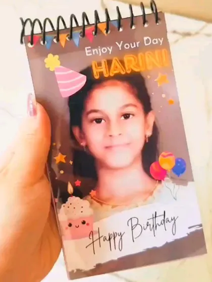 The mini photo album can also be customized for kids' birthdays, like this one with a fun and colorful "Enjoy Your Day" theme.