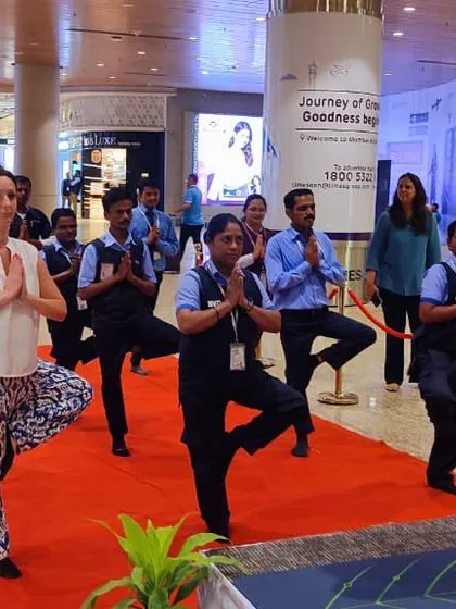 Airport staff at Mumbai International Airport participating in a yoga session. Even in the busiest of places, taking a few moments to stretch and breathe can make a significant difference in managing stress and maintaining energy levels.