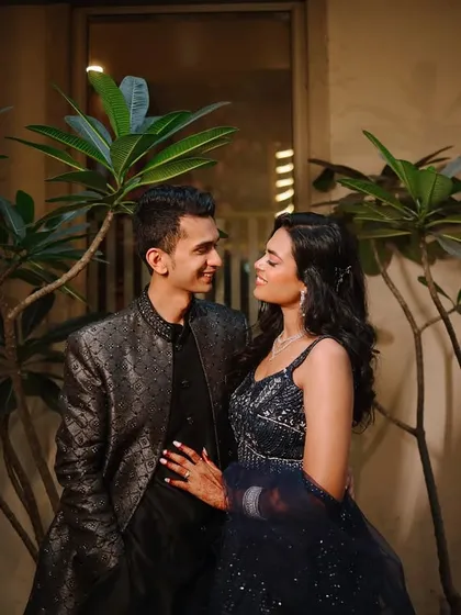 A natural and candid interaction between the couple. Their shared look and gentle smiles create an authentic portrait that feels both spontaneous and beautifully composed.