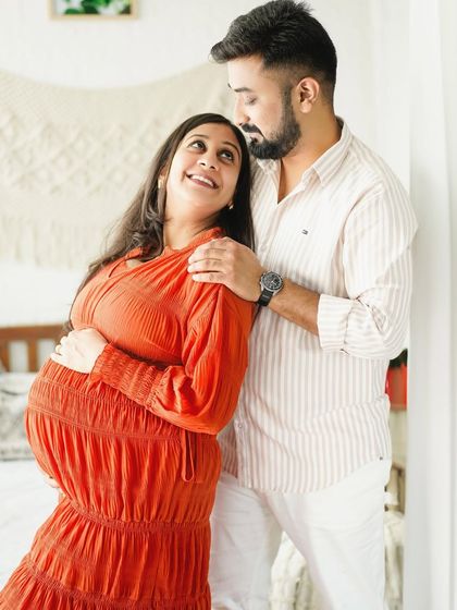 A loving look between partners during a cozy indoor session, highlighting their connection.
