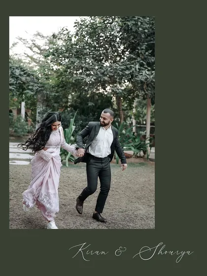 A spontaneous moment of the couple running hand-in-hand through a park. The movement in the bride's hair and their joyful expressions capture their energetic and playful spirit.