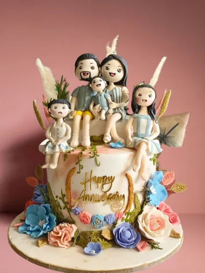 Celebrate family with a cake that’s as unique as your bond. This anniversary cake features custom-made fondant figures of the entire family, surrounded by beautiful floral details, creating a cherished and edible memory.