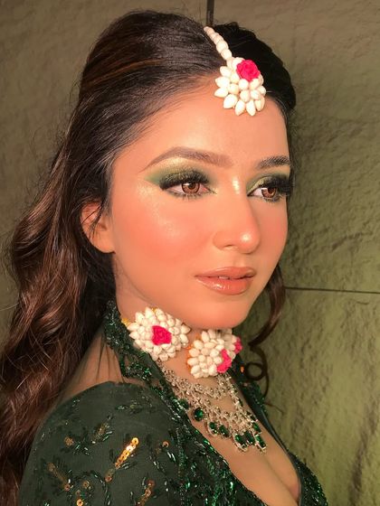 A detailed shot of the green smokey eye makeup. I use a mix of matte and shimmer shades to create depth and make the eyes pop.