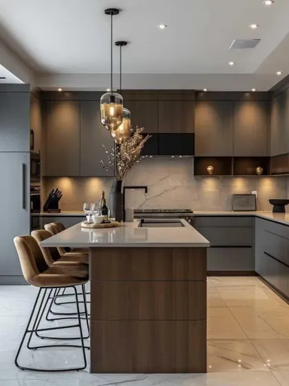 A dark and dramatic kitchen design with matte grey cabinets and a wood-accented island. The pendant lights and backlit shelves add warmth and create a luxurious ambiance.