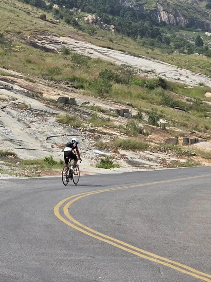 A solo rider tackling a winding, hilly road during the Rajyotsava 200k. The route included a mix of highways and scenic backroads, offering a great cycling experience.