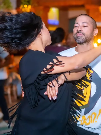 A dynamic shot of me and my partner Sai mid-spin. The energy on the dance floor is electric, and moments like this capture the freedom of Latin dance.